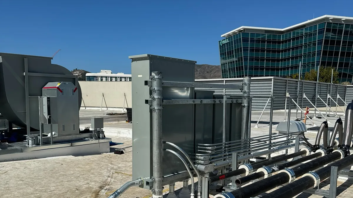 Rooftop power distribution and mechanical tie-in on a commercial building