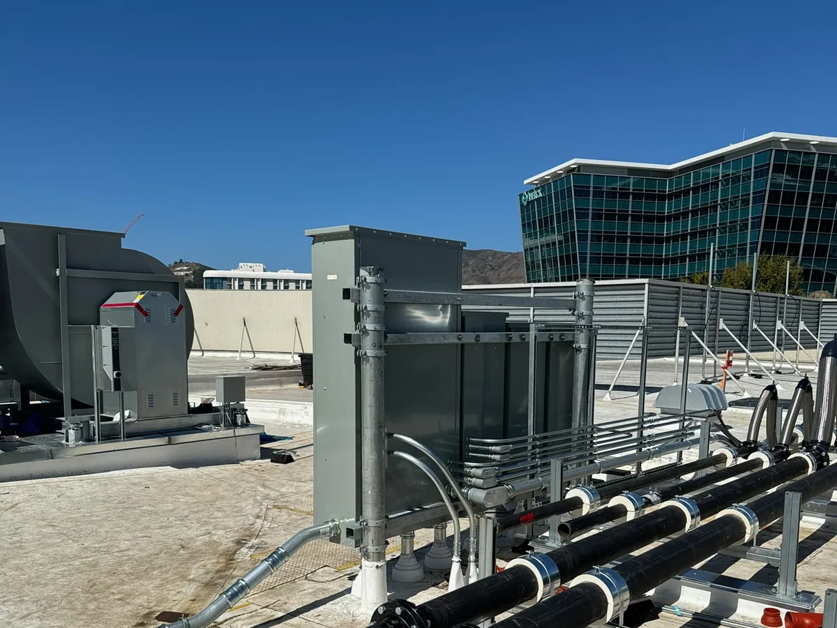 Rooftop mechanical power and piping on a commercial building